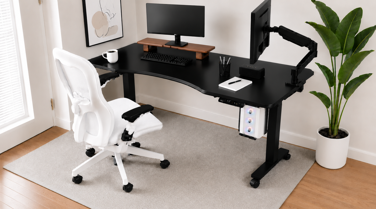 Height-adjustable desk setup with ergonomic chair, dual monitor arms and under-desk PC mount